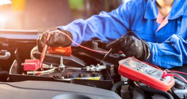 istockphoto-1216317856-612×612-1 Asian technician measure voltage of battery in the car at service station, Maintenance and repair
